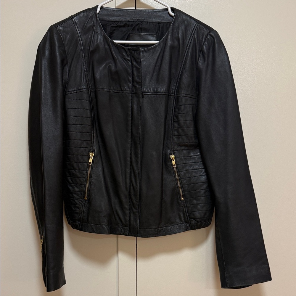 Mango Black Leather Jacket with Gold Accents
Genunie Leather